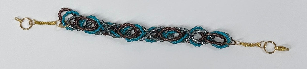 A beaded bracelet featuring intricate interlocking loops of turquoise blue beads, dark brown seed beads, and gold-toned metal chain links and clasps, shown against a plain white background.